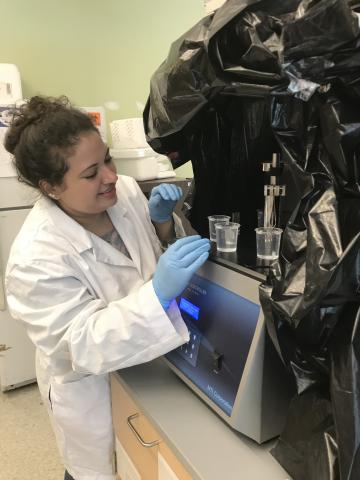 Alexis Nolfi in the laboratory running tests